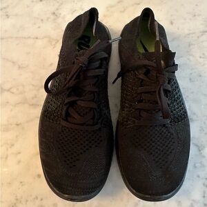 Nike women’s Nike Free running shoes. Color Black. Size 7.5. Lightly used.